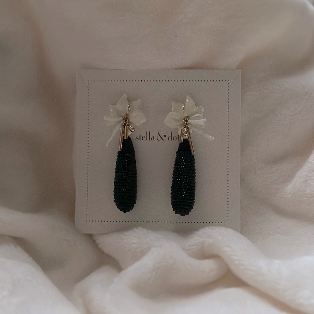 White floral w/ black beaded carrot earring